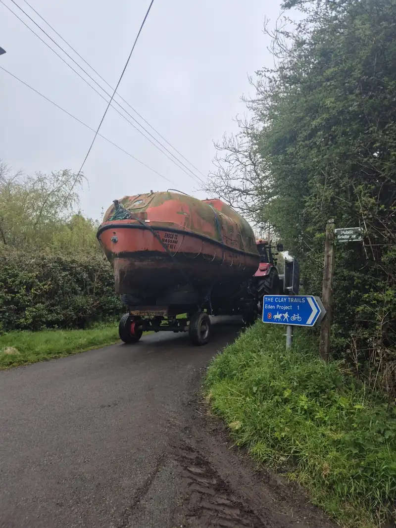 The lifeboat being pulled by tractor beside the Clay Trails sign