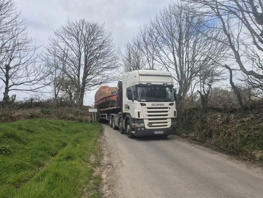 The lifeboat arriving by lorry on a narrow road near Trethurgy