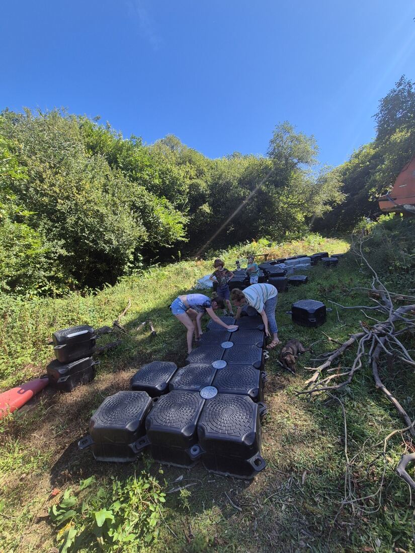 Modular pontoon sections being assembled beside Ennal’s Pool